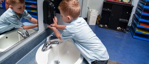 Child washing hands